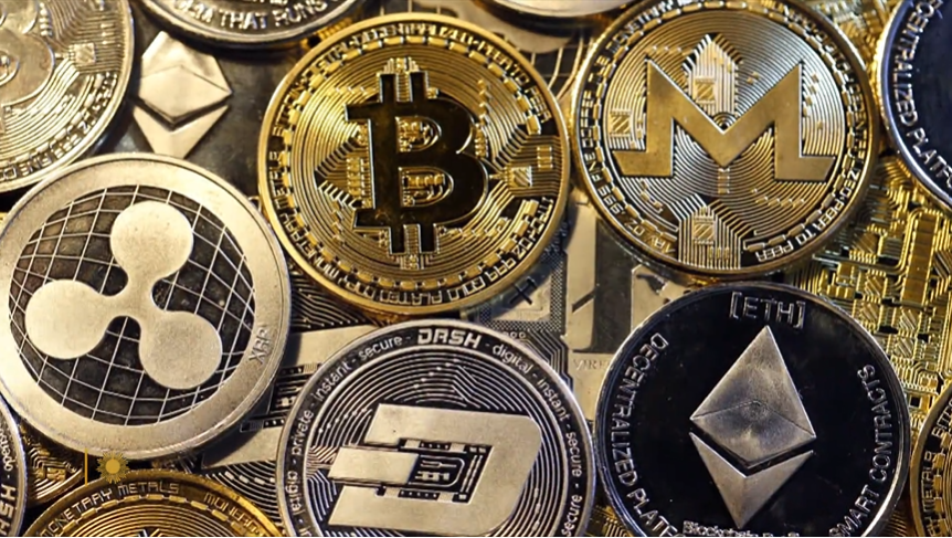A pile of physical cryptocurrency sits all together