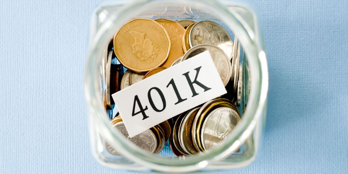 Glass coin bank displaying 401k label